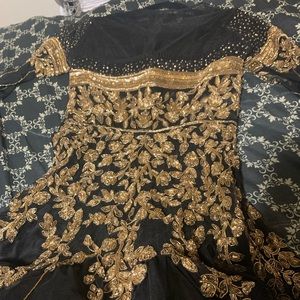 Black net heavily embellished gown